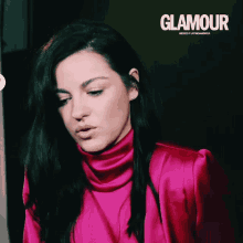 a woman in a pink turtleneck is on the cover of glamour