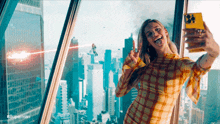 a woman is taking a selfie in front of a city skyline with #superman written on the bottom