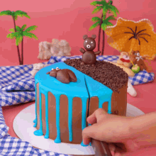 a cake with a teddy bear on top of it