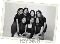 a group of women are posing for a picture and the caption says hey bruh
