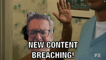 a man with glasses says " new content breaching " in front of another man