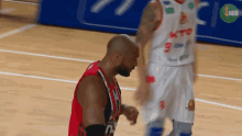 a basketball player wearing a white jersey with ktp on it