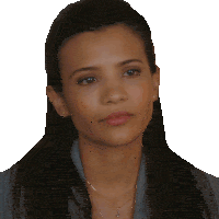 a woman wearing earrings and a necklace looks serious