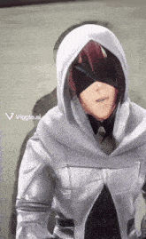 a person wearing a white hooded jacket has a viggle.ai sticker on the bottom right
