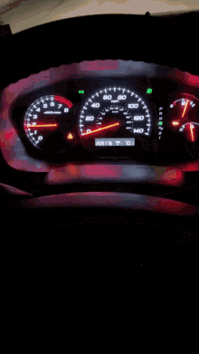 a close up of a car 's dashboard with a red x on it