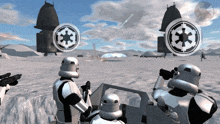 a group of stormtroopers are standing in a snowy field with a star wars logo on their helmets