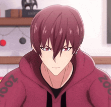 a man with red hair is wearing a red sweatshirt with the number 250 on the arm