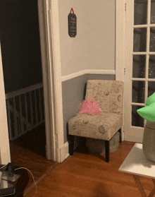 a chair in a corner of a room with a sign on the wall that says " please do not enter "