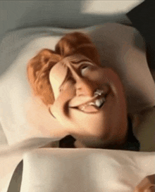 a cartoon character is laying in a bed with his eyes closed and a cigarette in his mouth .