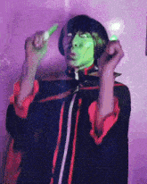 a person with a green mask on their face is blowing bubbles