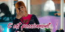 a woman covering her mouth with her hand and the words c ' est passionnant written below her