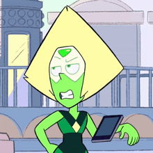 peridot from steven universe is holding a tablet and making an angry face