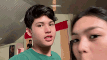 a boy and a girl are posing for a picture together