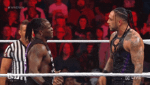 two wrestlers in a wrestling ring with the words #wweraw on the bottom right