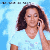 a woman is talking on a cell phone with the website starttamilchat.in visible