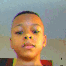 a pixelated image of a young boy 's face with the number 10 in the corner
