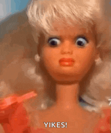 a close up of a barbie doll making a funny face and saying yikes
