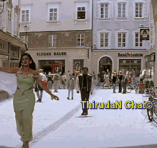 a woman in a green dress is walking down a street with a sign that says ' kleider bauer ' on it