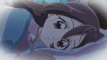 a close up of a girl laying down with her eyes closed