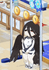 a girl with wings is sitting on a swing in a room