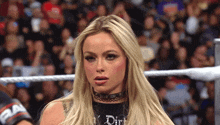 a woman wearing a choker that says dirt