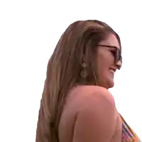 a woman wearing sunglasses laughs with her mouth wide open
