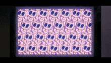 a screen with a pattern of cats with blue eyes