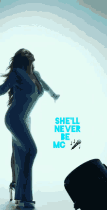 a woman in a blue dress is dancing with the words she 'll never be mc behind her