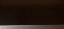 a pair of black shoes are laying on a table
