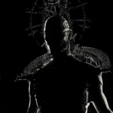 a silhouette of a person with a skull on top