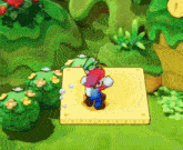 mario is standing on a yellow square in a game