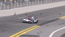 a race car is going around a curve on a race track