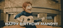 a puppet is playing a guitar in front of a brick building and says `` happy birthday mandy ! ''