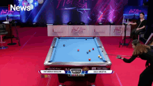 a pool table with a sign that says i news