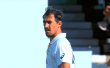 a man wearing a white shirt with the number 10 on the front