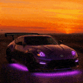 a purple nissan sports car is driving down a road