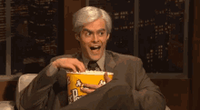 Gossip GIF - Bill Hader White Wig Eating Popcorn GIFs