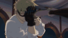 a man wearing a mask is being punched in the face by another man