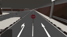 a red stop sign is in the middle of a highway
