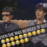 two men are sitting next to each other with a sign that says even she was weirded tf out