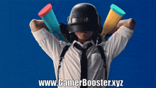 a man wearing a helmet and tie is holding two megaphones over his shoulder with the website www.gamerbooster.xyz written below him