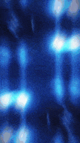 a dark blue background with a lot of light coming out of it