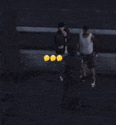 a group of people standing next to each other with yellow faces on their faces