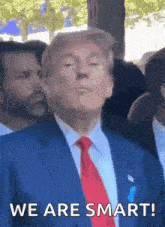 a man in a suit and tie says we are smart .