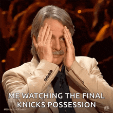a man covering his eyes with his hands and the words me watching the final knicks possession above him