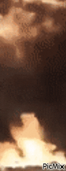 a picture of a cloudy sky with picmix in the bottom right corner
