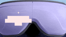 a pair of purple goggles with a pink square in the middle of them