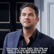 a man in a suit says you know i love gabi