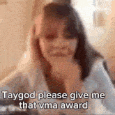 a blurred image of a woman with the words " i 'aygod please give me that vma award "