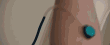 a person 's arm with a device attached to it that says ' x ' on it